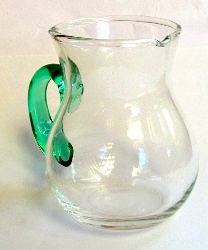 Hand blown glass creamer. Glass pitcher. Clear glass creamer. Small pitcher with green glass handle. Vintage.
