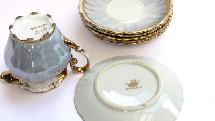 Porcelain creamer and saucers. Lusterware gold trim tea set. Bavaria crown milk pitcher and 6 small plates. Vintage.