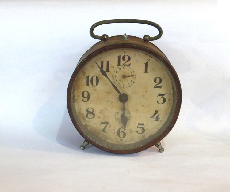 Vintage clock. Antique clock. Metal clock. Rusty metal. Alarm clock. Alarm clock vintage. Desk clock. Mechanical clock. Old clock. Italian.