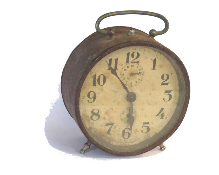 Vintage clock. Antique clock. Metal clock. Rusty metal. Alarm clock. Alarm clock vintage. Desk clock. Mechanical clock. Old clock. Italian.