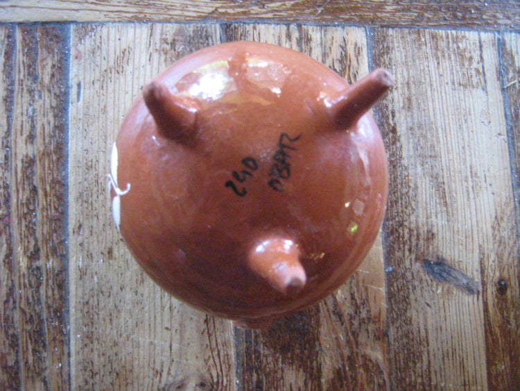 Portuguese handmade floral pottery. Made in Cabo da roca. Brown ceramics with white inscription.