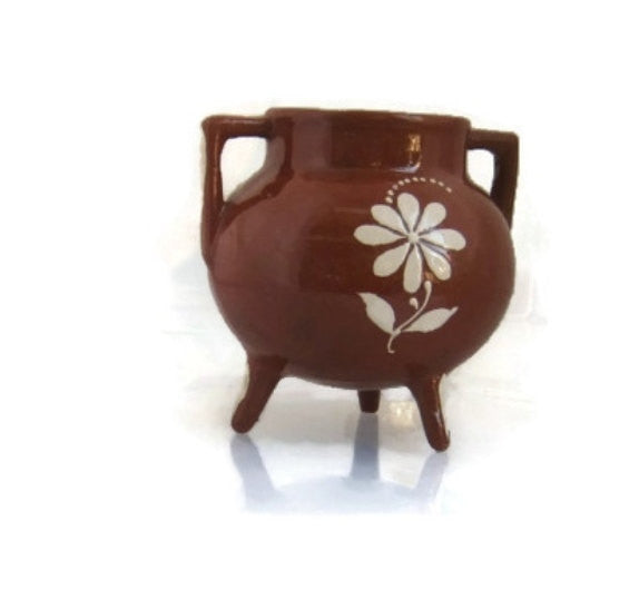 Portuguese handmade floral pottery. Made in Cabo da roca. Brown ceramics with white inscription.