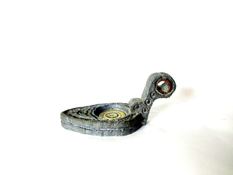 Cast metal candle holder. Shaped as an ancient oil lamp. Made in israel by amir. Vintage.