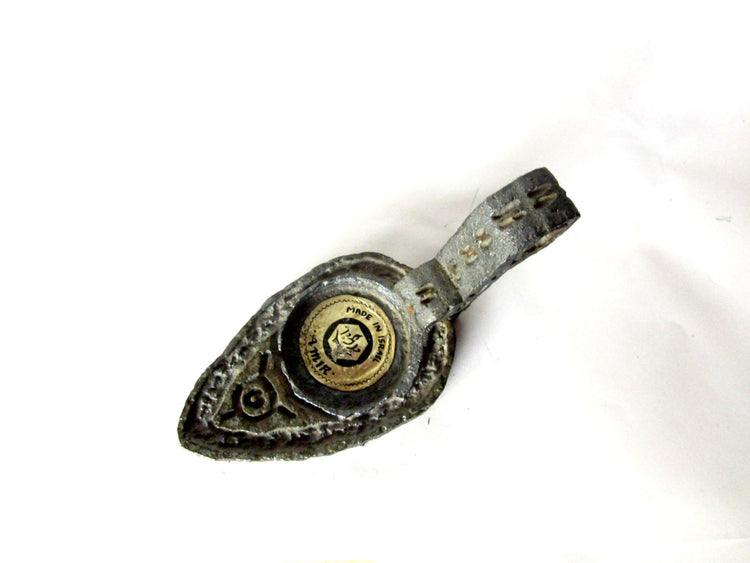 Cast metal candle holder. Shaped as an ancient oil lamp. Made in israel by amir. Vintage.