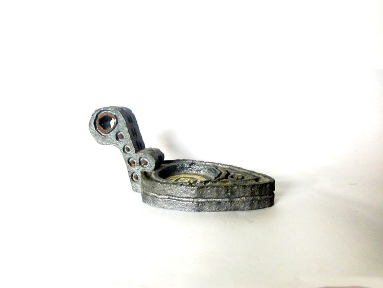 Cast metal candle holder. Shaped as an ancient oil lamp. Made in israel by amir. Vintage.