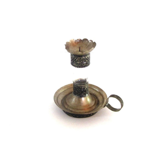 Vintage silver plated metal and glass candle holder. Shaped as an antique oil lamp. Ornate candlestick with handle.
