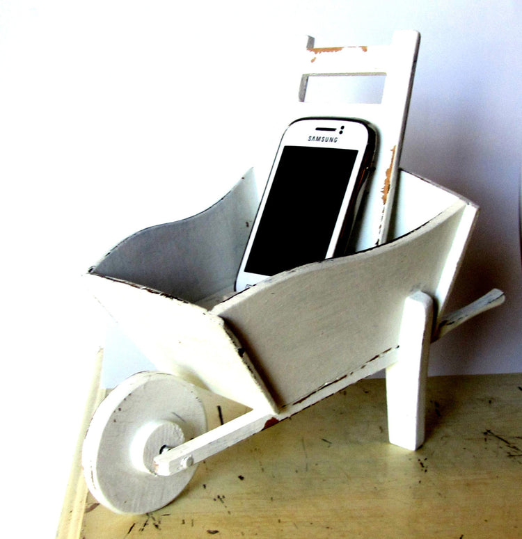 Cell phone charging station. Hand made wood wheelbarrow. White distressed shabby wooden charging station.