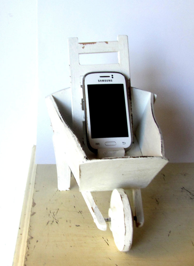 Cell phone charging station. Hand made wood wheelbarrow. White distressed shabby wooden charging station.