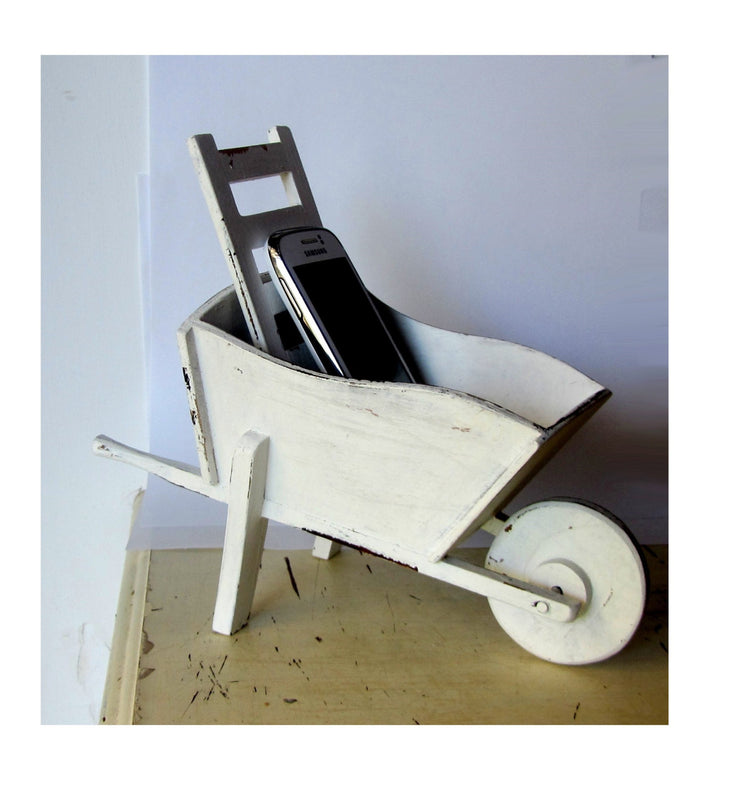 Cell phone charging station. Hand made wood wheelbarrow. White distressed shabby wooden charging station.