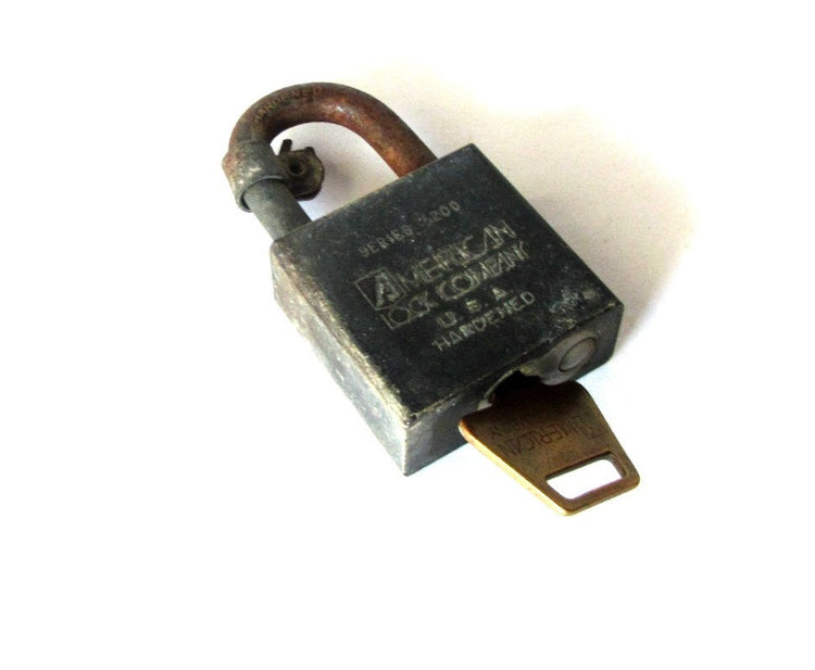 Padlock. Old metal lock. Rusty metal. Us army and government official lock. Made by the American lock company. Series 5200. Vintage.