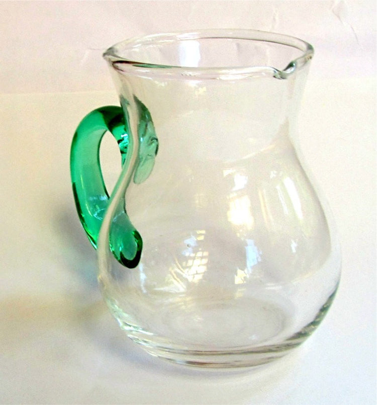 Hand blown glass creamer. Glass pitcher. Clear glass creamer. Small pitcher with green glass handle. Vintage.