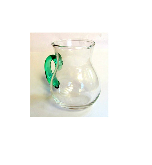 Hand blown glass creamer. Glass pitcher. Clear glass creamer. Small pitcher with green glass handle. Vintage.
