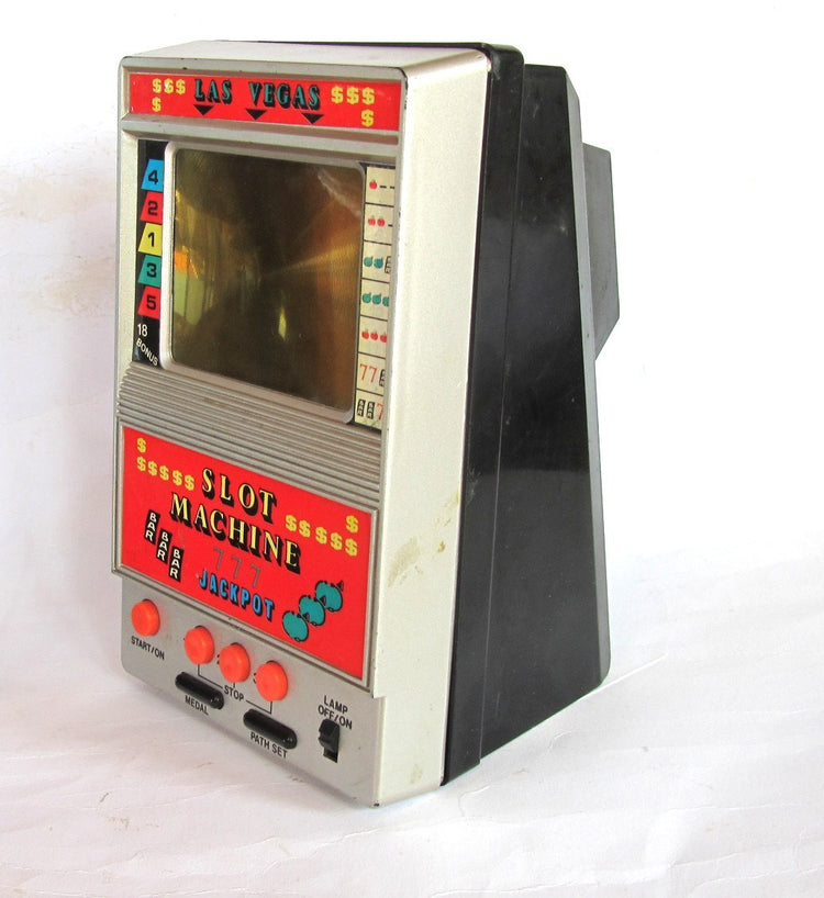 Electronic game. Las vegas. Electronic toy. Casino. Gambling. Gambling gift. Slot machine. Arcade game. Vintage electronic slot machine toy.